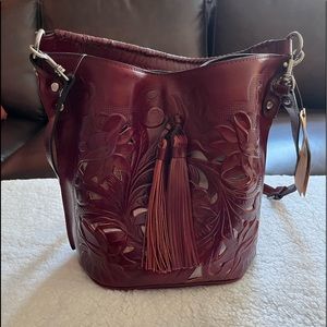 Patricia Nash Otavia Bucket Bag, color is Ox Blood